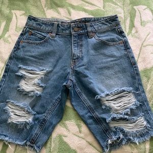 Never worn above the knees denim shorts.